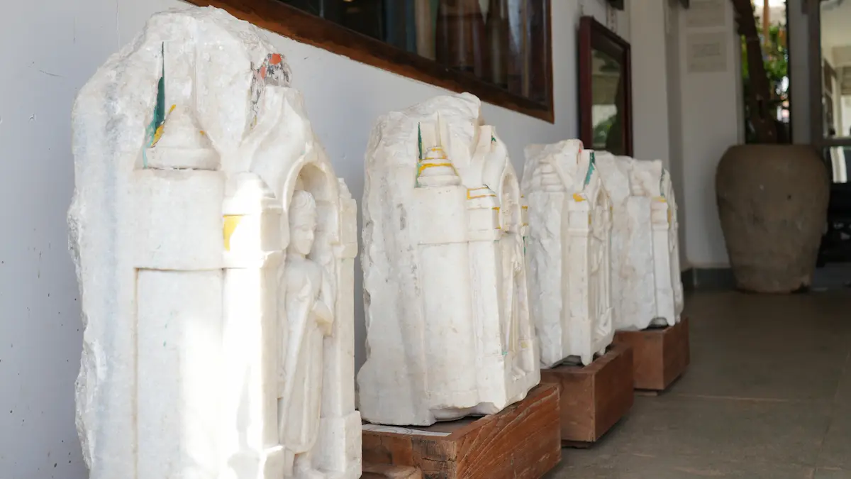 Vintage stone sculptures displayed at Circa Warehouse showcasing antique architectural artefacts